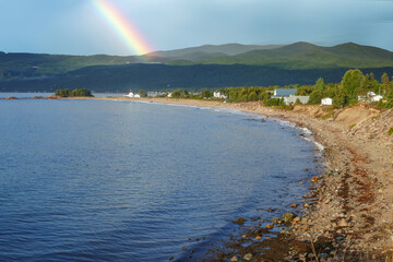  sandy empty coast at Nova Scotia in Canada with view to coastal landscape in Baddeck, Canada