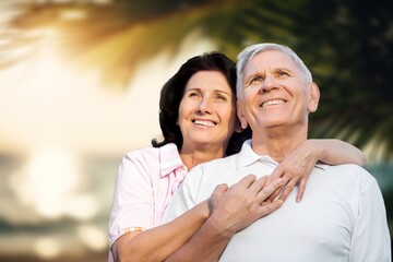 Fototapeta premium Happy senior couple have fun at the beach at vacation