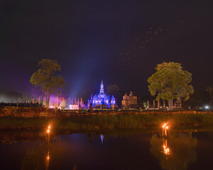 Sukhothai Historical Park festival, buddha pagoda stupa in a temple, Sukhothai, Thailand. Thai buddhist temple architecture at night. Tourist attraction.