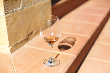 Wineglass on brick border in yard