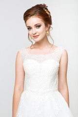 Young pretty caucasian bride in wedding dress