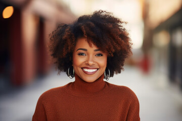 Portrait of beautiful laughing african american woman on background