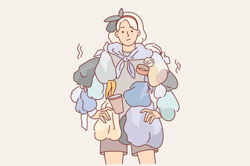 Woman wearing clothes from trash draws attention to problem recycling waste to care for environment