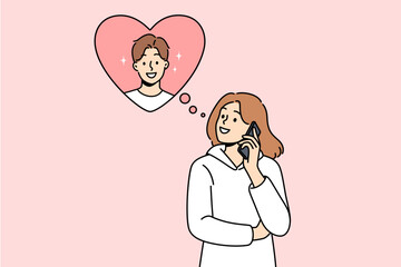 Woman makes phone call to boyfriend, wanting to flirt or invite him to romantic weekend dinner. Distance relationship between girl and boyfriend during vacation or happy valentine day