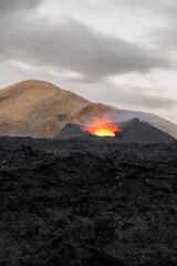 Crater of the erupting volcano, long exposure. Active Volcano eruption at Fagradalsfjall in the Meradalir valley, Iceland. Unique natural attraction. © Lizaveta