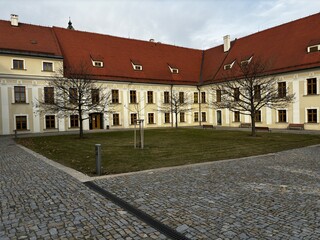 Carthusian monastery courtyard reconstructed into college
