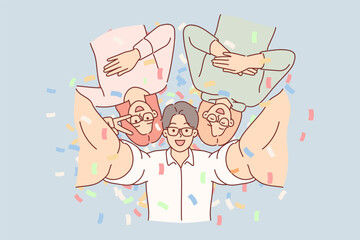 Cheerful friends take selfie together at party in nightclub, posing among falling confetti