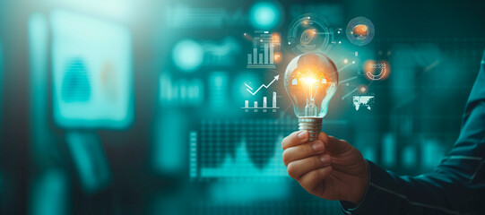 Businessman holding creative light bulb with growth graph, analytics icons. Utilizing analytics technology to develop new strategies and insights that enhance successful performance in global business