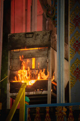 Crematorium, Thai tradition, with a fire burning in the coffin.