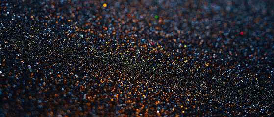 Close-Up View of Glittering Sparks on a Dark Surface in Soft Light