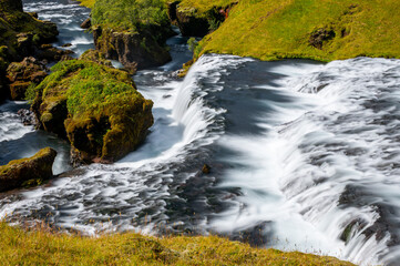 Long exposure view of famous waterfalls of river Skógá. Skógafoss. Magnificent Iceland in august. Fimmvörðuháls Hiking Trail. Popular Travel destinations. Hestavaðsfoss waterfall
