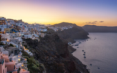 Sunrise in the Greek village of Oia Santorini with a view of the caldera in the sea, Greece 