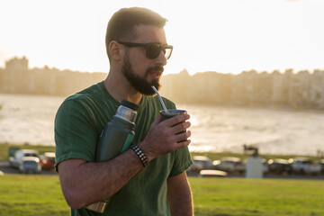 Man drinking chimarrão, mate (an infusion of yerba mate with ho - 715804217