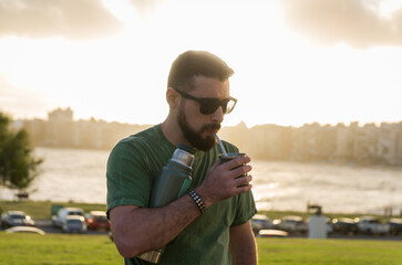 Man drinking chimarrão, mate (an infusion of yerba mate with ho - 715804228