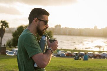 Man drinking chimarrão, mate (an infusion of yerba mate with ho - 715804241
