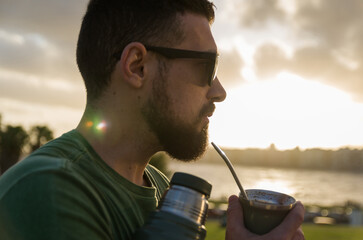 Man drinking chimarrão, mate (an infusion of yerba mate with ho - 715804297