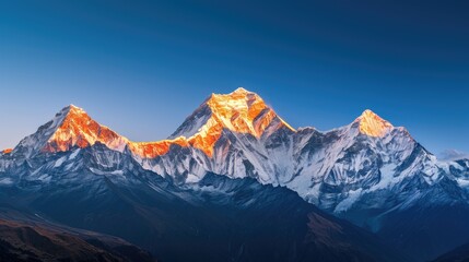 Golden Sunrise on Snow-Capped Mountains