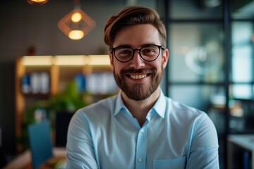 Fototapeta premium Happy confident businessman in office looking at camera