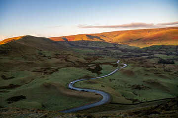 The sunrises over Edale Valley in the Peak District seen from the summit of Mam Tor.