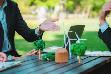 Group of asian business people presenting environmentally friendly development plan and sustainable...
