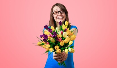 Smiling young lady hold bouquet of fresh flowers