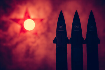 Silhouettes of missiles against the background of the North Korean flag