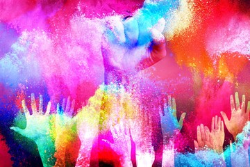 Holiday Holi colored explosion with human hands