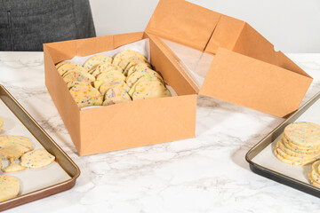 Packing Sprinkle-Adorned Sugar Cookies into Boxes
