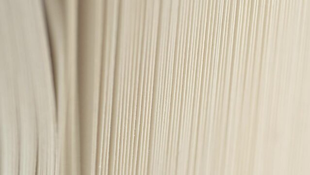 Macro shot of flipping white pages of a book. Old books page background.