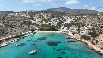Aerial drone photo of paradise sandy beach of Agios Georgios with natural tree shade next to main...