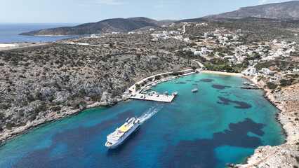 Aerial drone photo of paradise sandy beach of Agios Georgios with natural tree shade next to main...