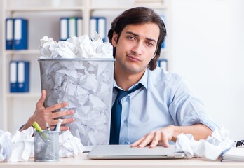 Businessman rejecting new ideas with lots of papers