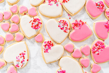 Heart-shaped sugar cookies with royal icing - obrazy, fototapety, plakaty