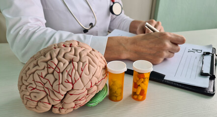 Doctor writes medical prescription for neuropsychiatric pill