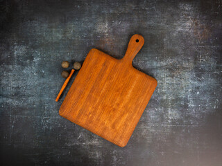 Wooden cutting board on dark grunge background. Top view flat lay kitchen mock up. - 715844877