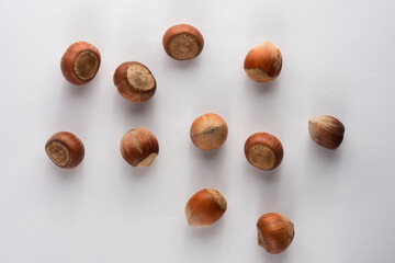 Top view of hazelnuts on white background
