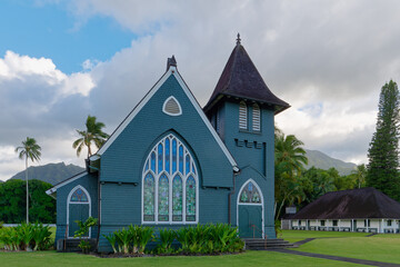 Fototapeta na wymiar Front view of a wooden Waioli Huiia Church with cloudy sky in the background in Hanalei, Kauai, Hawaii 