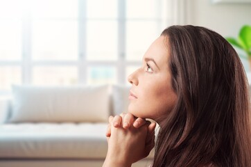 worship young woman praying for hope at home