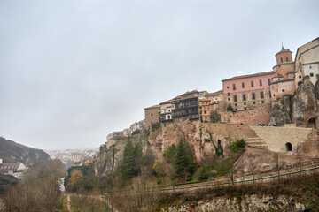 Fototapeta na wymiar Hanging house on the cliff with wooden balconies in Cuenca, Spain