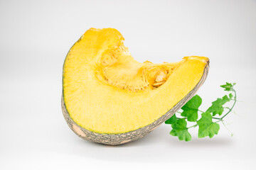 Sliced pumpkin chunks isolated on white background