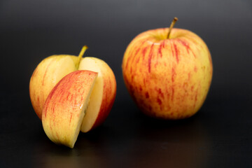 Apple with a slices isolated on black background with clipping path.