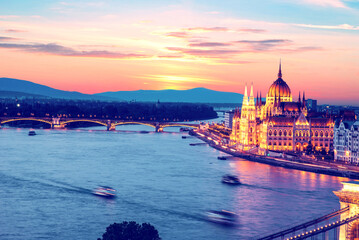 Incredible spectacular picturesque sity landscape of the Parliament and the bridge over the Danube in Budapest, Hungary at sunset. Charming places.
