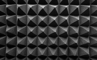 Black pyramids as an abstract background. Acoustic foam.