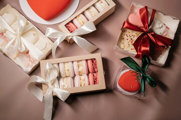 set of Valentine's day desserts with macaroons, ice cream and heart-shaped cakes top view