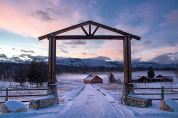 Old Wooden Barn at the Edge of an Evergreen Forest at Dusk - Methow Valley, Washington, USA...