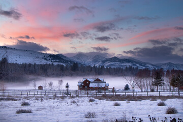 Country House in the Mist at the Edge of an Evergreen Forest at Dusk - Methow Valley, Washington,...