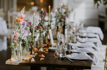 Wedding Top Table with colourful flowers and candles 