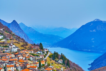 Mountain Bre village against the Alps in fog, Ticino, Switzerland