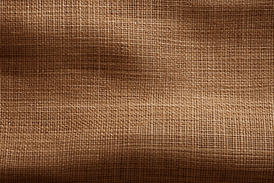 Natural fabric abstract background. Beige cotton woven sofa cushion fabric texture background. High resolution. Rustic texture