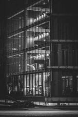 Kalnciema street in Riga, Latvia during twilight. Night photography, street photography with long exposure. Beautiful public building with night during night time with traffic in the foreground